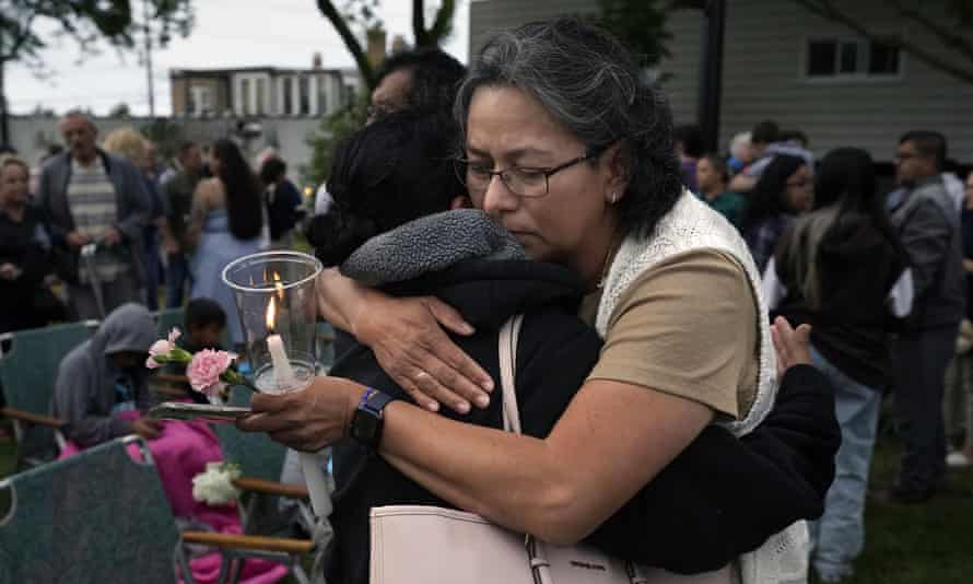 Lucy Barajas hugs Elvia Toledo, the niece of Nicolas Toledo, who was killed during Monday’s Highland Park Fourth of July parade, during a vigil connected 6 July.