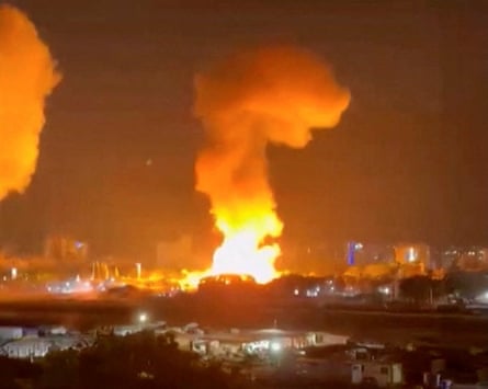 Smoke and fire rises from explosions in Caracas, Venezuela