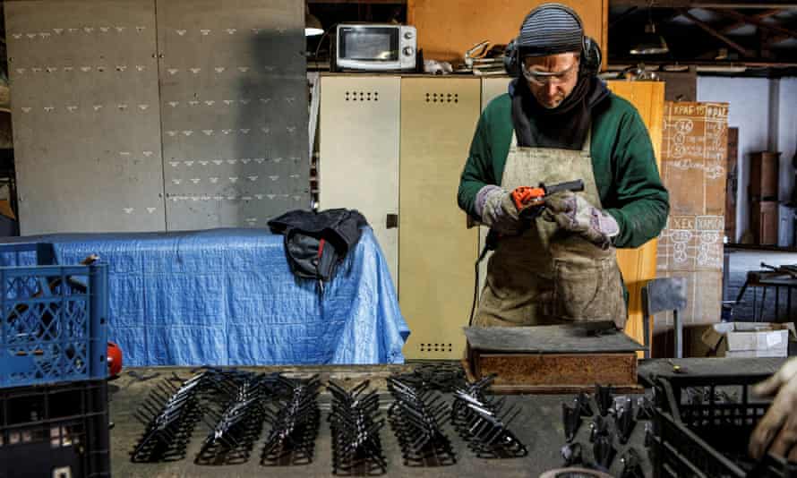 Artists produce demining equipment to send to the Ukrainian military at a studio in the city of Perechyn, Zakarpattia region, Ukraine.