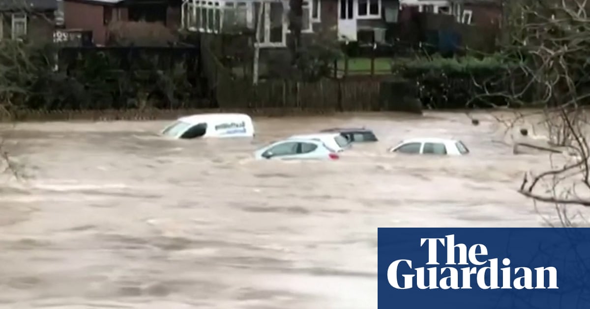 Storm Dennis: cars swept away by flooding in Wales – video