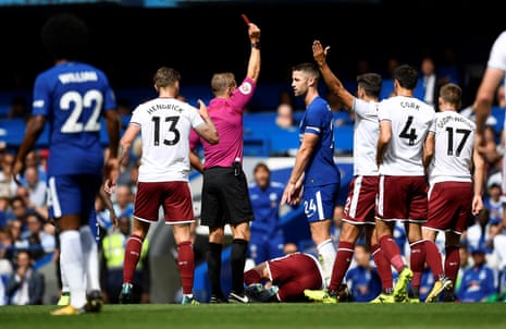 Gary Cahill is shown the red card by referee Craig Pawson.