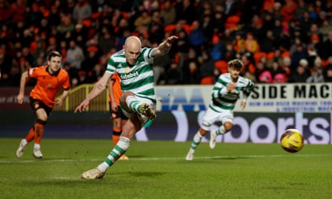 Celtic's Aaron Mooy shoots to score with his right foot his side’s second goal from the penalty spot against Dundee United.