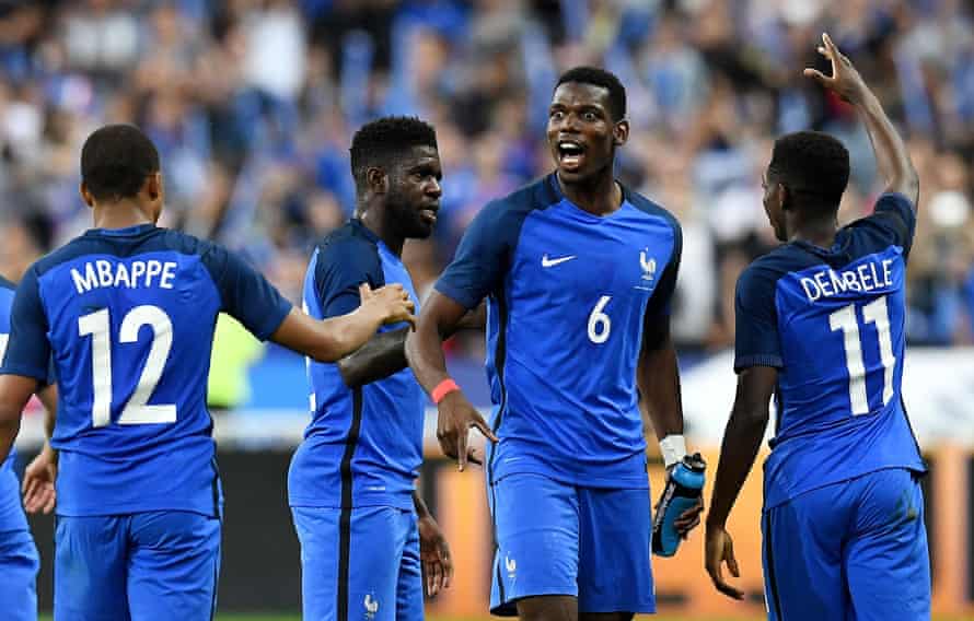 Paul Pogba celebrates the third goal with Dembele and Mbappé.
