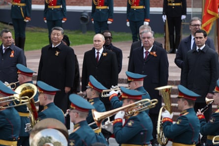 Vladimir Putin (centre), with Xi Jinping (second left) at a wreath-laying ceremony before the Unknown Soldier’s Tomb