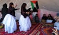 Performers and traditional activities ongoing in the traditional tents Ausserd Refugee camp , Algeria, set up for the FiSahara film festival, held 29 April-5 May 2024. Approximately 170,00 live in the 5 Sahrawi refugee camps located in Algeria’s Hamada desert, each named after a major town in Western Sahara, The camps were begun in 1975 to offer shelter from the war of independence against Morocco . They continue to grow in people fleeing the war , reignited when Morocco broke the ceasefire in 2020 .