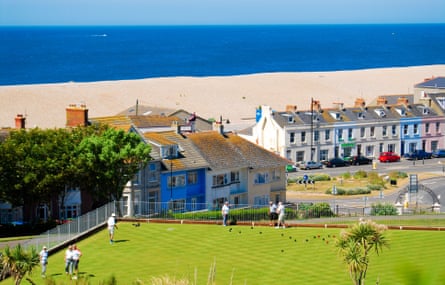 People play lawn bowls by the sea, Victoria Park, Isle Of Portland Seasonal weather, Dorset