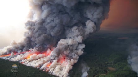 Aerial footage shows a raging wildfire in British Columbia that has burned through an estimated 241,214 hectares in Donnie Creek in June 2023.