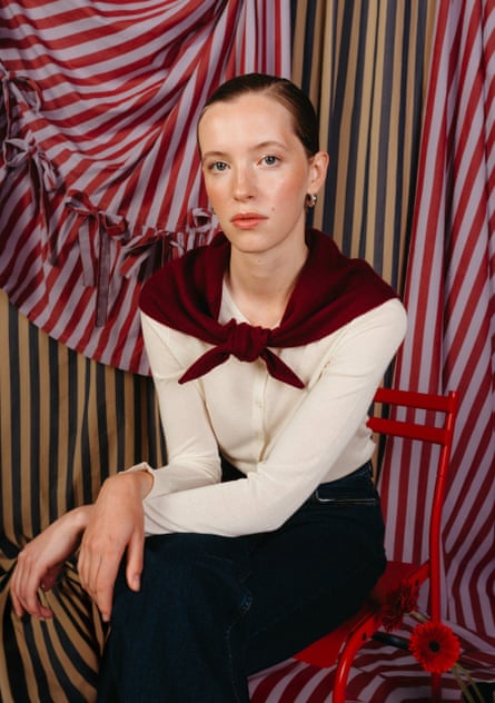 woman wearing burgundy scarf around neck