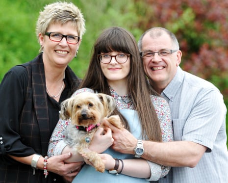 Sandra, Emma and Peter Wright reunited with their yorkshire terrier Eddie.