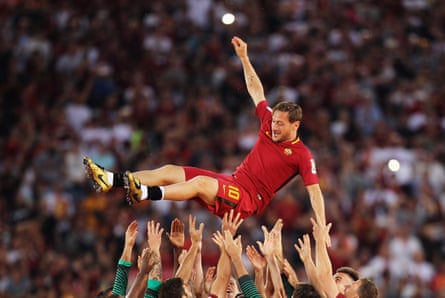 The Roma players hoist up Totti after his last match for the Giallorossi in 2017.
