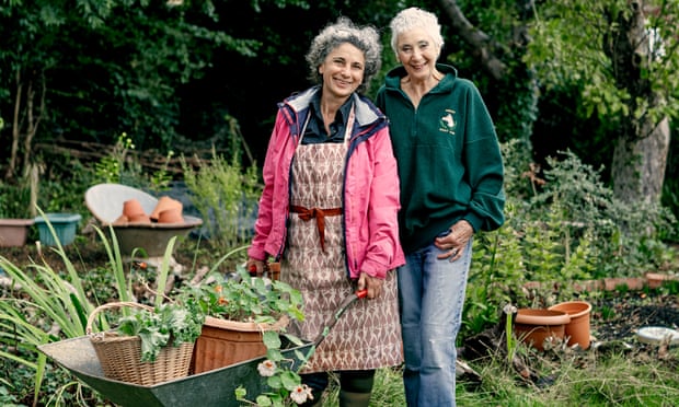 A spot to develop: the gardener and land proprietor pairings making blissful unions and loads of produce | Gardens 2 Rosa Mechoni, hands on a wheelbarrow, stands next to Helen Webster in Helen’s garden, both smiling