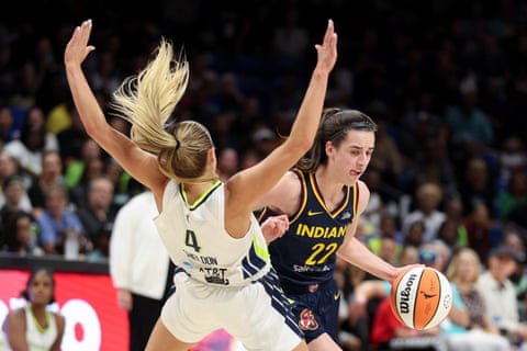 WNBA rookies collide as Indiana’s Caitlin Clark drives to the basketbal against Dallas’ Jacy Sheldon during a preseason game on Friday.