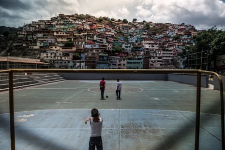 Children play on a football pitch in Mamera, one of the most dangerous slums in Caracas. The lack of food is also causing an educational crisis, since many mothers refuse to take their children to school on an empty stomach