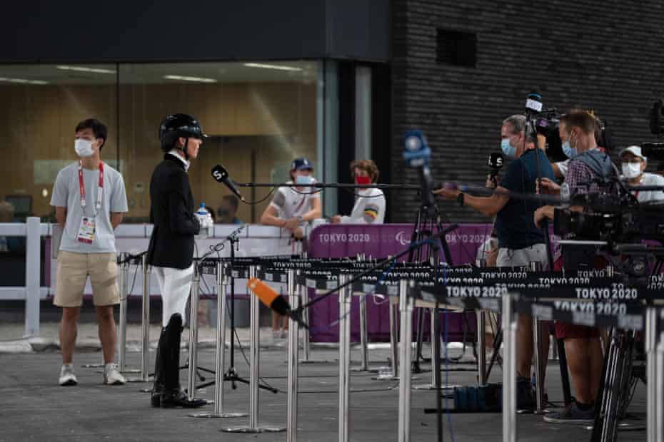 Michele George of Belgium observes social distancing rules as she is interviewed after competing with the horse Best Of 8 in the dressage. Belgium ended up placed fifth.