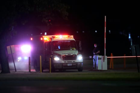 an ambulance drives on a road