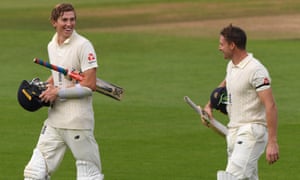 Zak Crawley and Jos Buttler leave the field after adding 205 for the fifth wicket on the first day of the third Test against Pakistan.