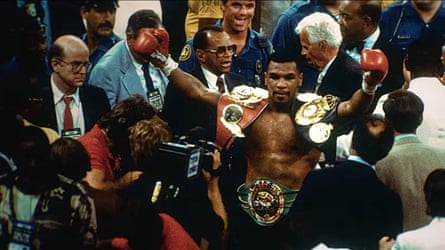 Tyson celebrates his heavyweight win over Michael Spinks in 1988.
