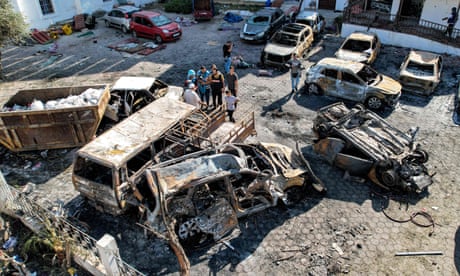 Burnt out vehicles by the al-Ahli Arab hospital in Gaza