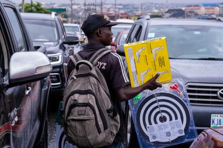 Ojo Nduka offers dartboards and ‘Tummy Trimmers’ to stranded drivers
