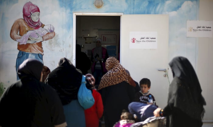 Syrian refugee women attend a breast cancer awareness seminar held by Save the Children at al Zaatari refugee camp in the Jordanian city of Mafraq.