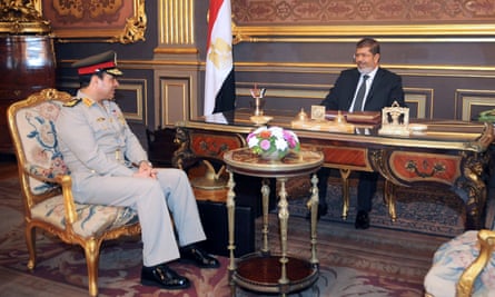 Morsi, right, and Abdel-Fatah al-Sisi at the presidential palace in Cairo in 2012