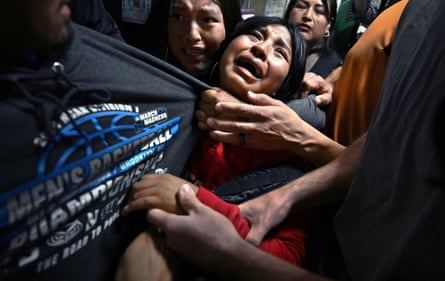 Distraught girls cling to their father, Luis, as US Immigration and Customs Enforcement (ICE) detains him following an immigration hearing in New York City, New York, United States, 26 August 2025