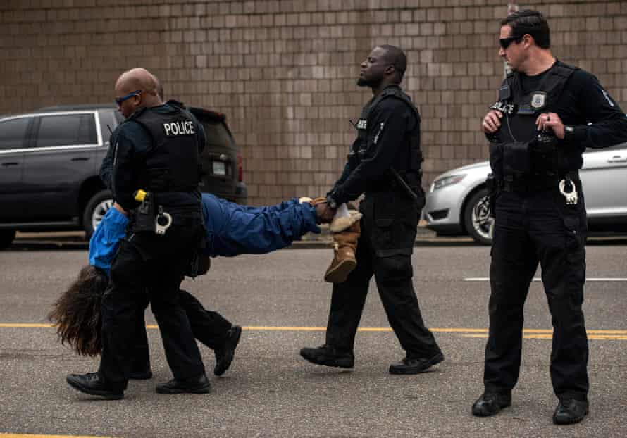 Police arrest Elizabeth Vega during a protest against treatment of immigrants in detention in front of the Shelby County Criminal Justice Center on April 3 in Memphis, Tenn.