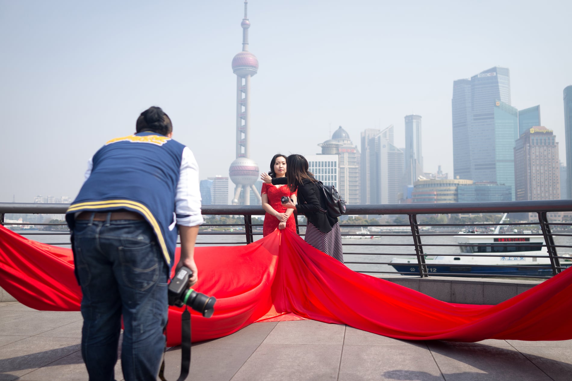 A warm spring morning in Shanghai on The Bund, where several pre-wedding shoots are happening simultaneously