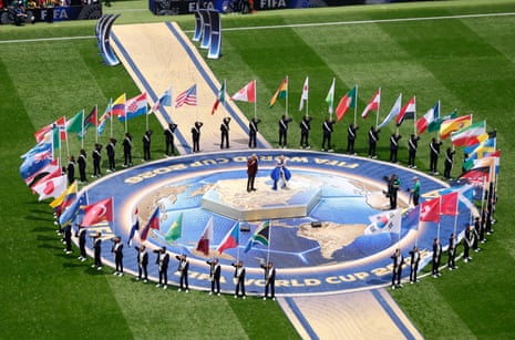 Italian singer Andrea Bocelli and South Korean-American singer and songwriter Ejae perform during the opening ceremony.