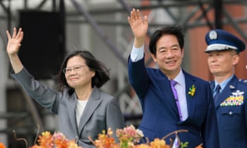 Taiwan's President Lai Ching-te (R) waves alongside outgoing president Tsai Ing-wen during the inauguration ceremony at the Presidential Office Building in Taipei on 20 May 2024.