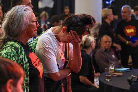 Yes supporters in Sydney react to the defeat of the voice referendum.