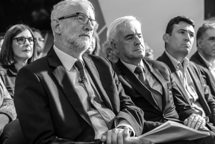 Jeremy Corbyn, John McDonnell and Andy Burnham sat in the audience at an event