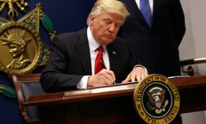 Donald Trump signs an executive order to impose tighter vetting of travellers entering the US, targeting Muslim-majority countries and shutting down refugee entry.