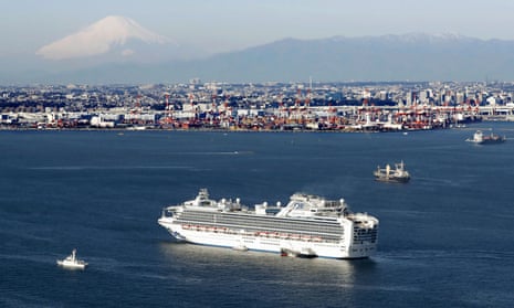 The Diamond Princess cruise ship quarantined off Yokohama in Japan. Mount Fuji can be seen in the background.
