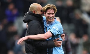 Newcastle United v Manchester City - Premier League<br>NEWCASTLE UPON TYNE, ENGLAND - JANUARY 13: Pep Guardiola the head coach / manager of Manchester City celebrates with Kevin De Bruyne of Manchester City during the Premier League match between Newcastle United and Manchester City at St. James Park on January 13, 2024 in Newcastle upon Tyne, England. (Photo by Robbie Jay Barratt - AMA/Getty Images)