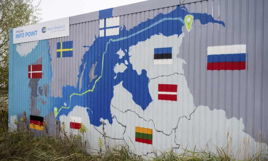 A sign reading ‘Nord Stream 2 Committed. Reliable. Safe’ hangs above a painted map at the natural gas receiving station in the Lubmin industrial estate in Lubmin, Germany.