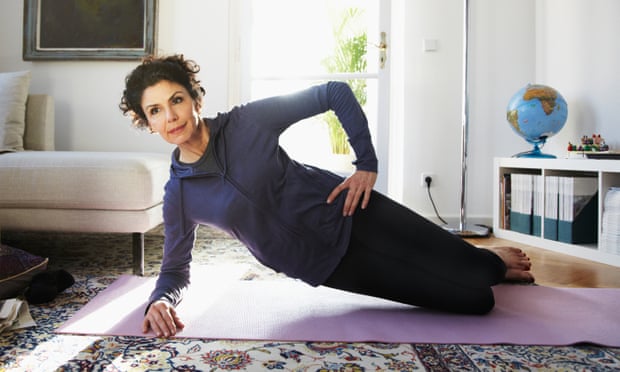 woman doing yoga at home