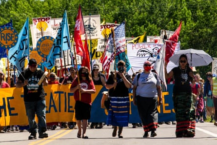 Climate activists and Indigenous community members march in Solway, Minnesota.