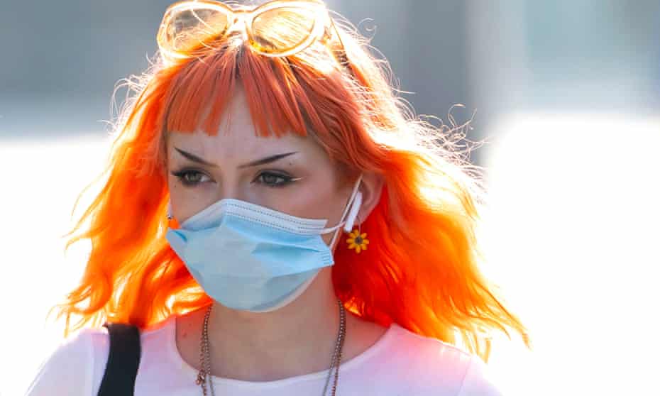 A woman wears a face mask in Cardiff, Wales