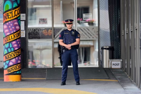 A police officer guars the entrance of a school where a former student opened fire the day before fatally wounding 10 people and injuring many others before taking his own life, Graz, Austria.