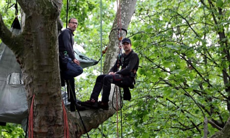 Thomas Brail (right) was on hunger strike attached to a plane tree bordering the Eiffel Tower