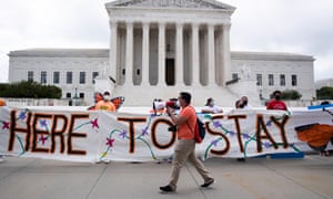 Immigration advocates gather outside the supreme sourt following a ruling blocking Donald Trump’s bid to end the Daca program on Thursday.