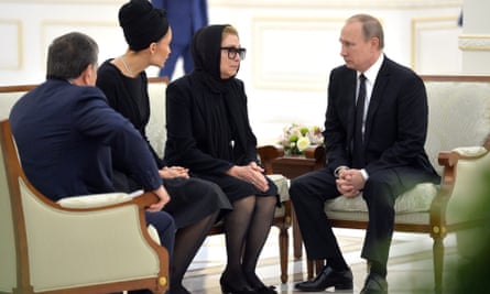Karimov’s wife Tatyana Akbarovna Karimova and daughter Lola are consoled by Vladimir Putin.