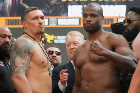Usyk and Dubois look on at yesterday’s weigh-in.