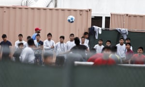 Immigrant boys play soccer at the Homestead child detention facility in Florida.