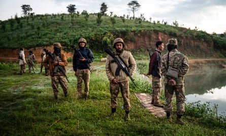 This photo taken on December 11, 2023 shows members of the Mandalay People’s Defense Forces (MDY-PDF) at a checkpoint near the frontline amid clashes with Myanmar’s military in northern Shan State. A squad of Myanmar pro-democracy fighters works quickly to ready drones for an attack on a nearby military base, the latest target in a wave of aerial assaults that has helped turn the war against the junta.