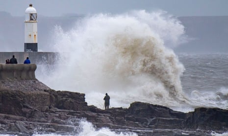 Waves crash against coast