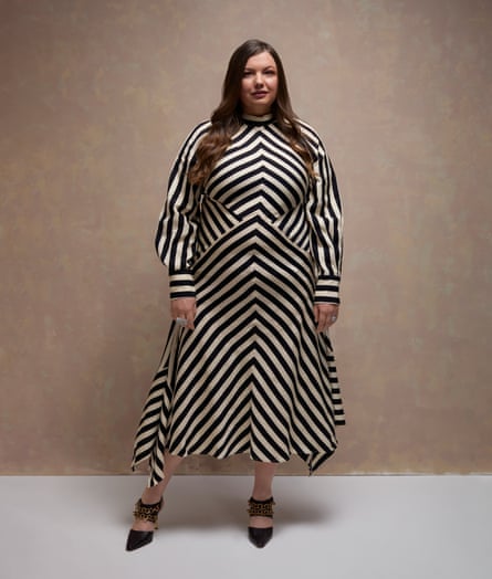 Hannah Murray wears black and cream striped midi dress with black pointed shoes