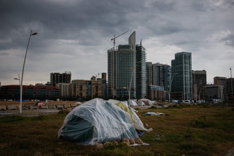 Tents of displaced families covered with plastic sheeting to shield from stormy weather along Beirut’s seafront.