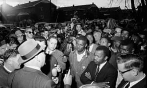 John Lewis, front with arms folded, in Selma in 1965.